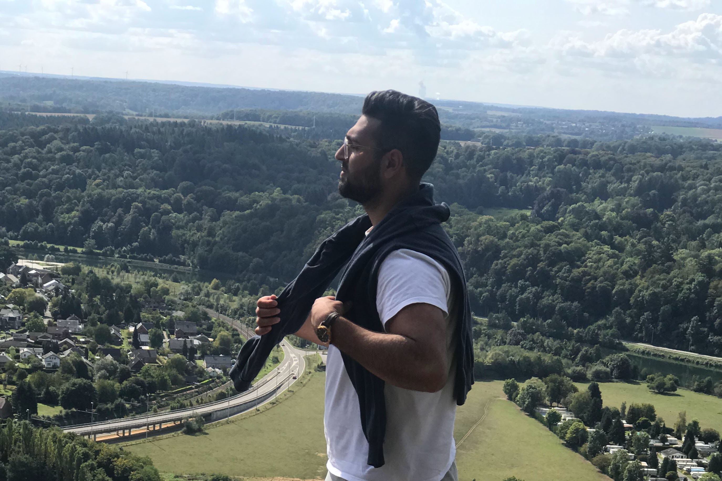 sideways picture of man with town afar