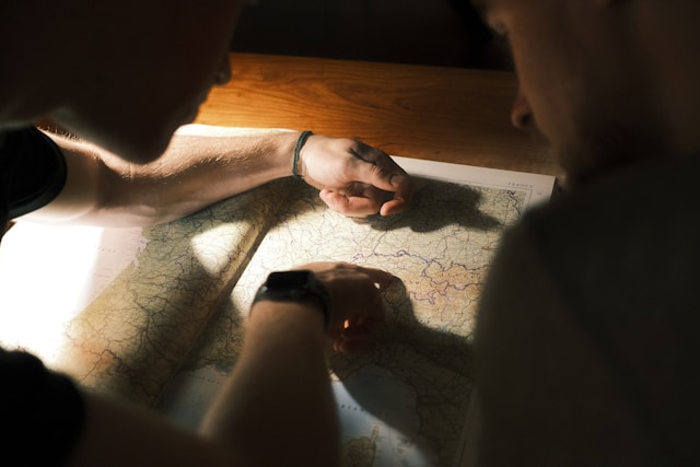 two people looking at a map